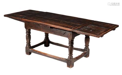 An oak draw-leaf table