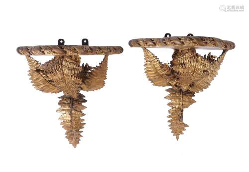 A pair of gilt wood and composition wall brackets in 18th ce...