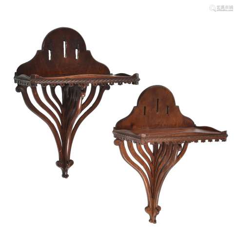 Two mahogany wall brackets of similar form