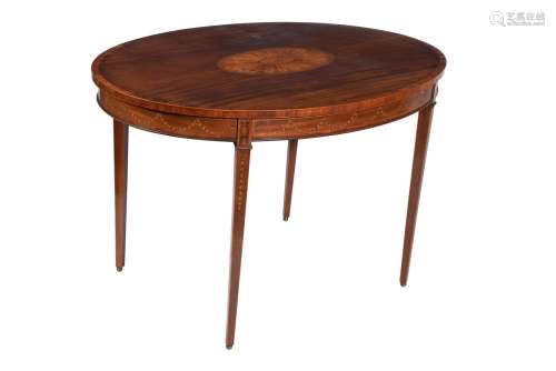 Y A mahogany, tulipwood banded, and inlaid oval centre table...