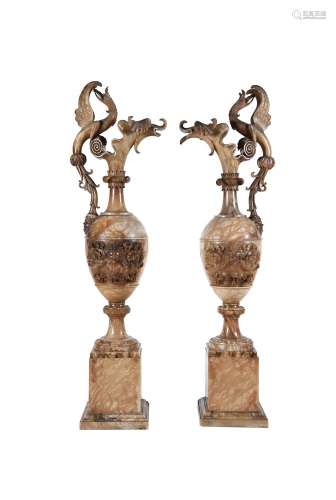 A pair of sculpted alabaster ewers