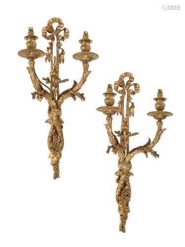 A pair of French gilt bronze twin light wall appliques in Lo...