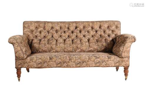 A Victorian oak and button upholstered sofa
