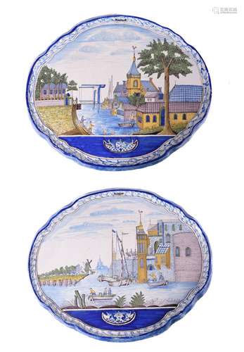 A pair of Dutch Delft polychrome shaped oval horizontal wall...