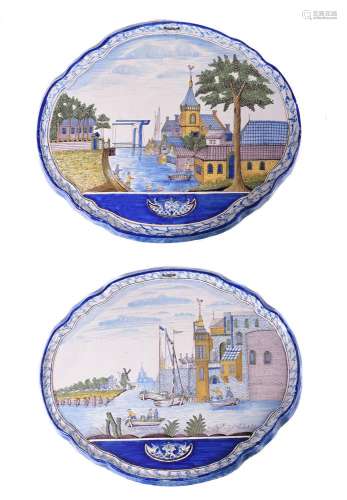 A pair of Dutch Delft polychrome shaped oval horizontal wall...