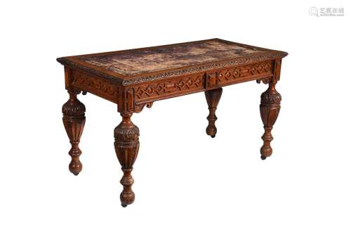 A Victorian carved oak writing table