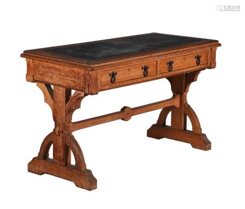 A Reformed Gothic oak and inlaid writing table