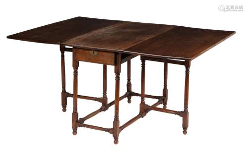 A chestnut, fruitwood and oak gate leg table