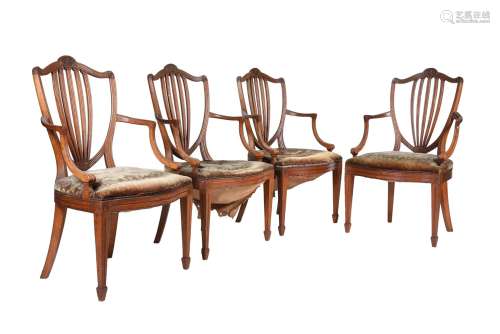 A set of four oak and upholstered armchairs in George III st...