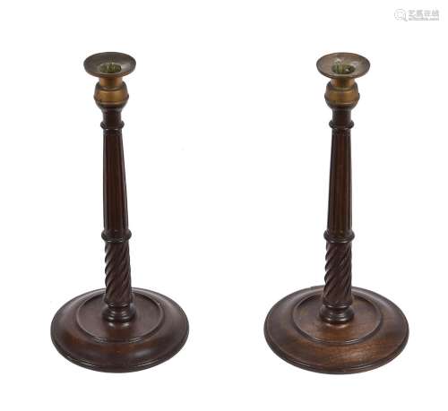 A pair of mahogany and brass candlesticks in George III styl...