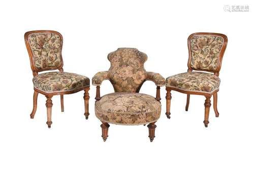 A Victorian walnut and upholstered low armchair