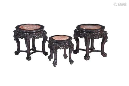 A pair of Chinese of carved hardwood and marble inset low ta...