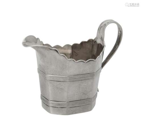 A George III silver octagonal cream jug by Charles Chesterma...