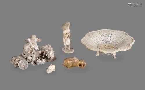 Y A Japanese Ivory Group of a man and boy seated on a large ...