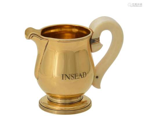 Y A French silver gilt baluster cream jug