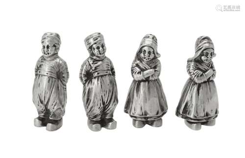 Two pairs of German silver figural pepperettes by B. Nereshe...