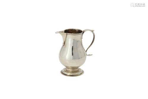 A George III silver baluster cream jug by George Greenhill J...