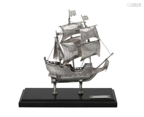 A silver coloured model of a galleon