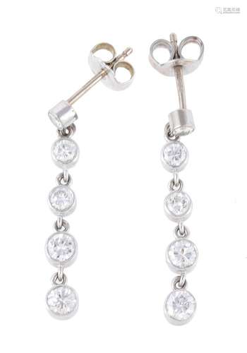 A pair of diamond drop earrings