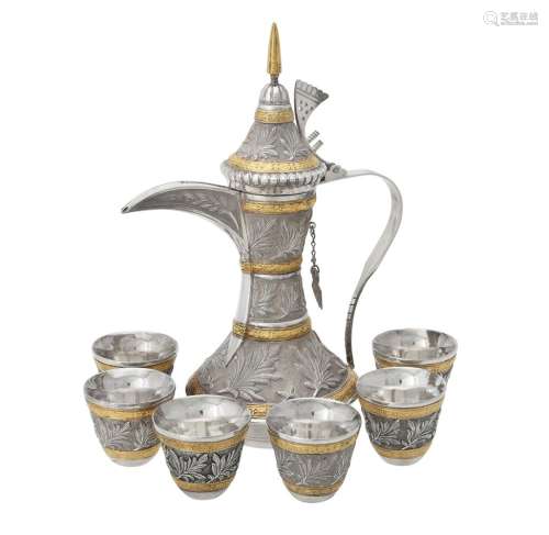 An Omani silver coloured and gilt coffee pot and six cups