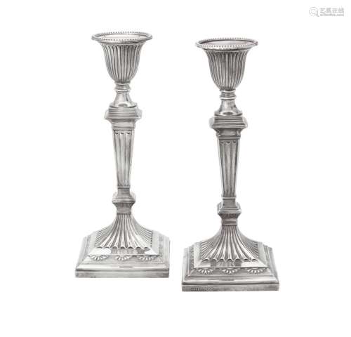 A pair of Victorian silver candlesticks by Hawksworth