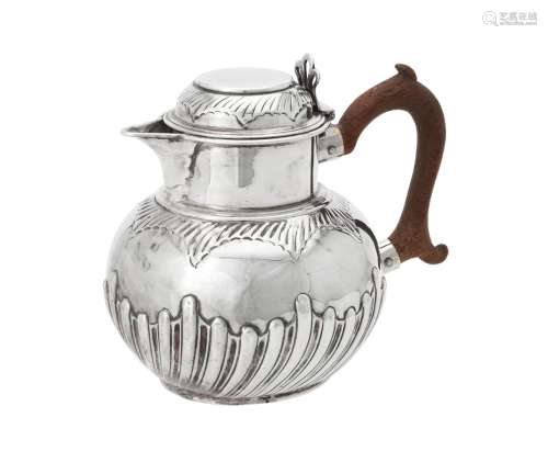 A Victorian silver half lobed circular jug by Charles Stuart...