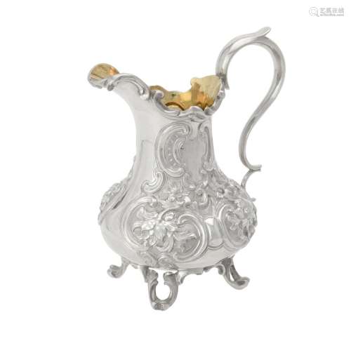 A Victorian silver baluster cream jug by Charles Reily & Geo...