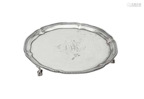 A George III silver shaped circular waiter by Thomas Pratt &...