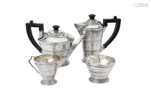 Y An Art Deco silver four piece circular tea set by Dennison...