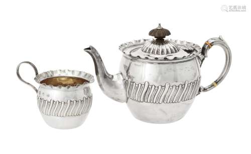 Y A Victorian silver circular tea pot and cream jug