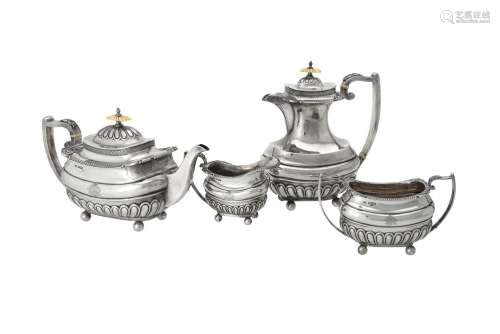 Y A silver four piece oblong baluster tea set by Walker & Ha...