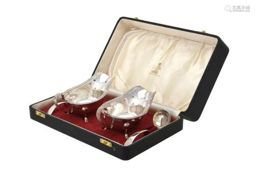 A cased pair of silver oval sauce boats and Old English patt...