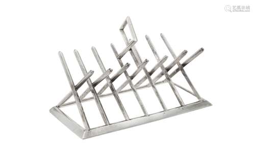A Victorian silver six division toast rack by George Fox