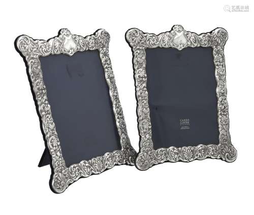A pair of silver mounted shaped rectangular photo frames by ...