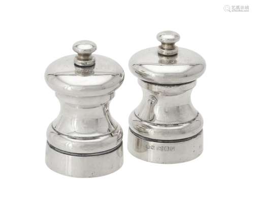 A pair of silver pepper grinders by Whitehill Silver & Plate...