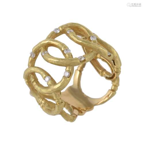 A gold coloured diamond dress ring