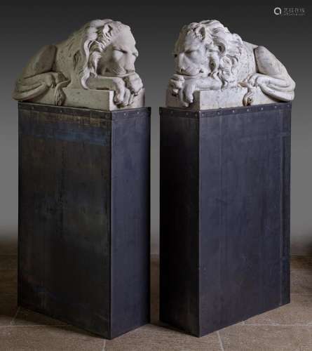 A pair of fine sculpted Carrara marble models of recumbent l...