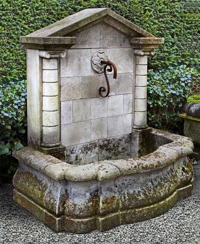 A monumental wall fountain, of architectural form