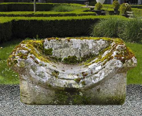 A carved limestone garden bench