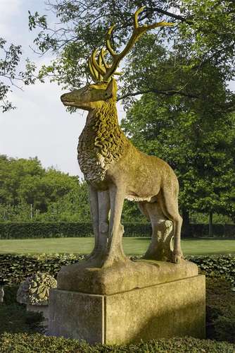 A large and impressive sculpted limestone and antler mounted...