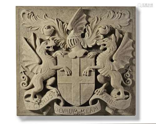 A sculpted limestone armorial panel