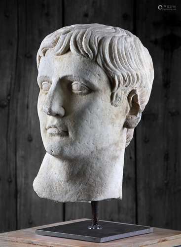 A sculpted white marble head of a male