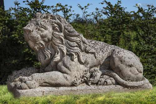 A sculpted limestone of a recumbent lion
