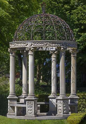 A carved limestone and wrought iron mounted garden rotunda