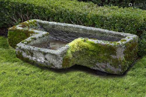 A carved limestone trough