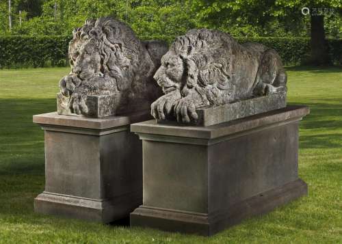 A pair of sculpted limestone models of recumbent lions