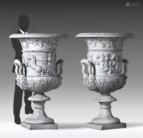 A pair of monumental Italian sculpted white marble urns in t...