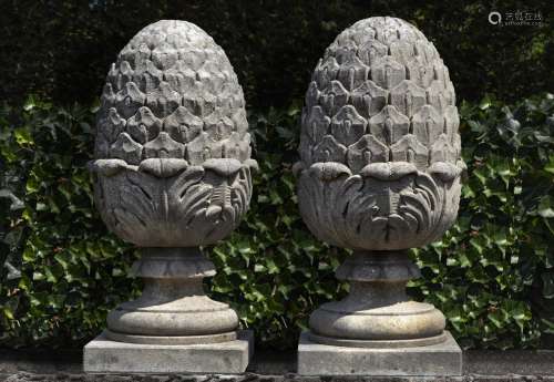 A pair of carved limestone pier finials
