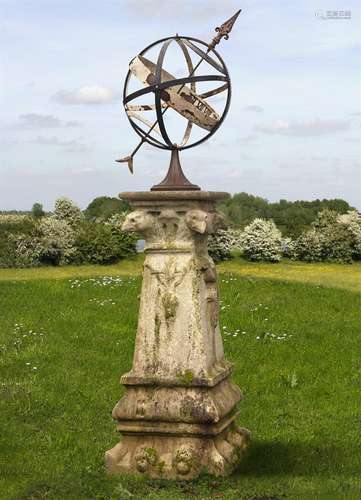 A wrought and cast iron mounted carved limestone armillary s...