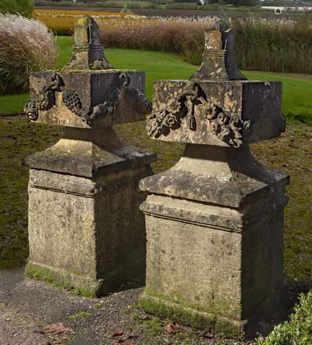 A pair of carved sandstone pier finials